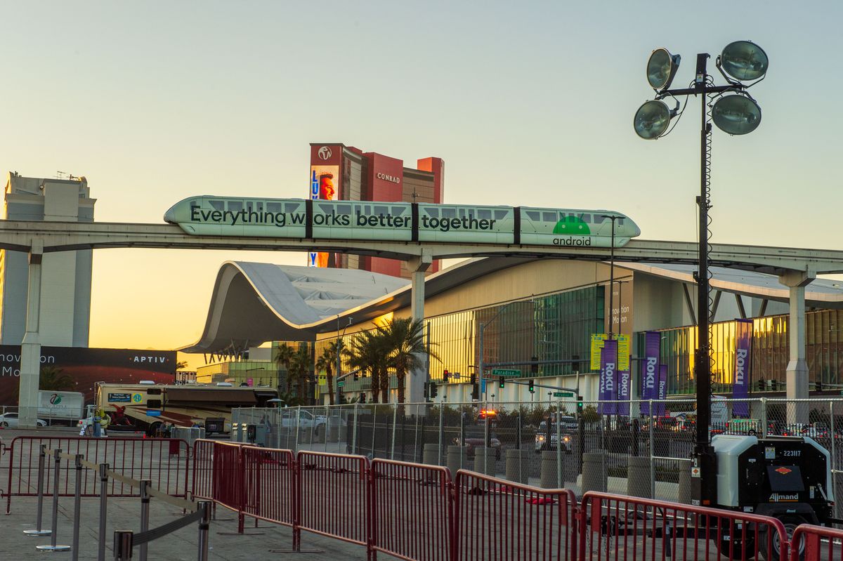 A monorail with the Google advertising slogan “everything works better together” rides past the railing at the CES tech show in Las Vegas in January 2022.