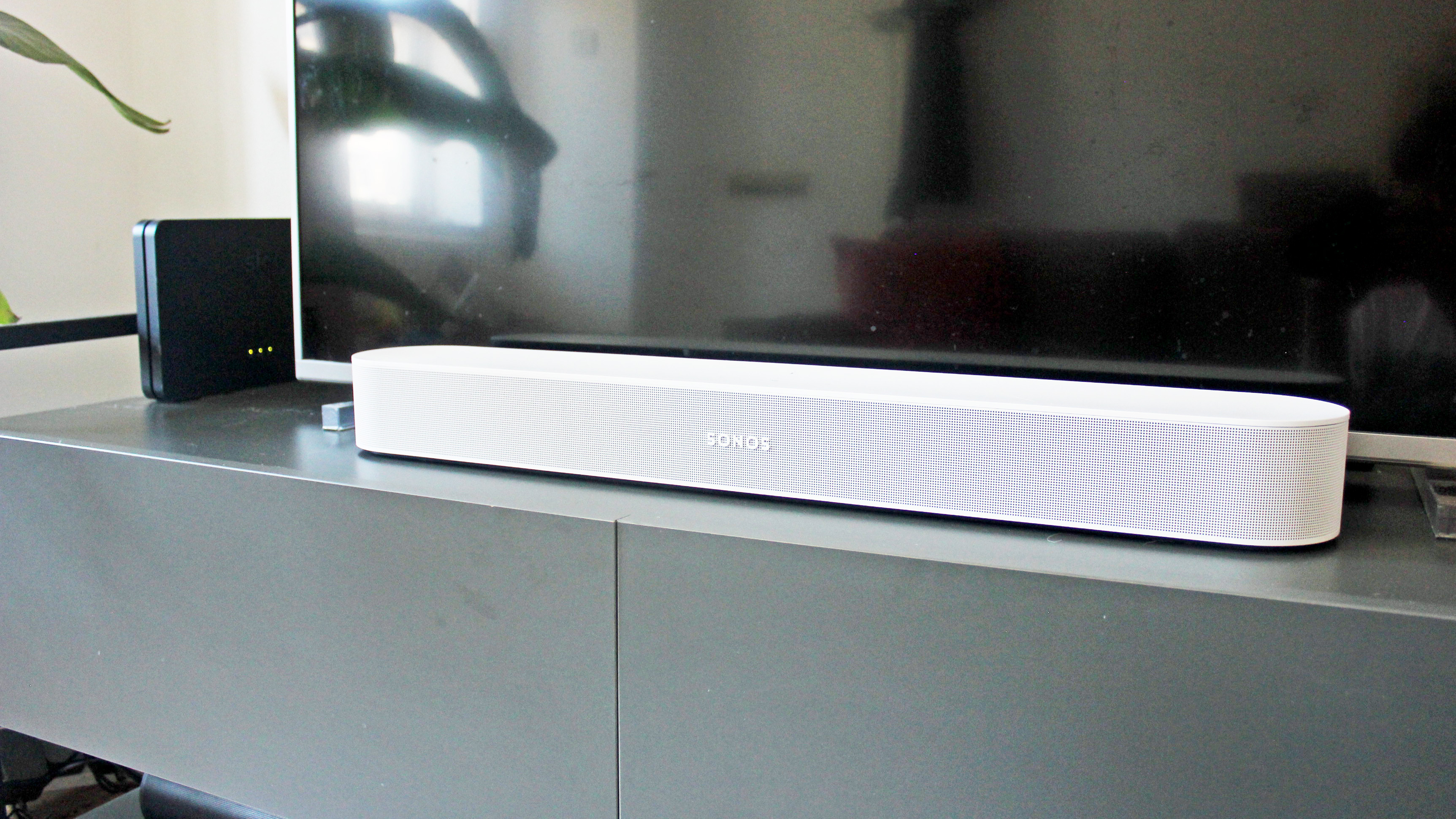 the sonos beam gen 2 soundbar on a tv cabinet