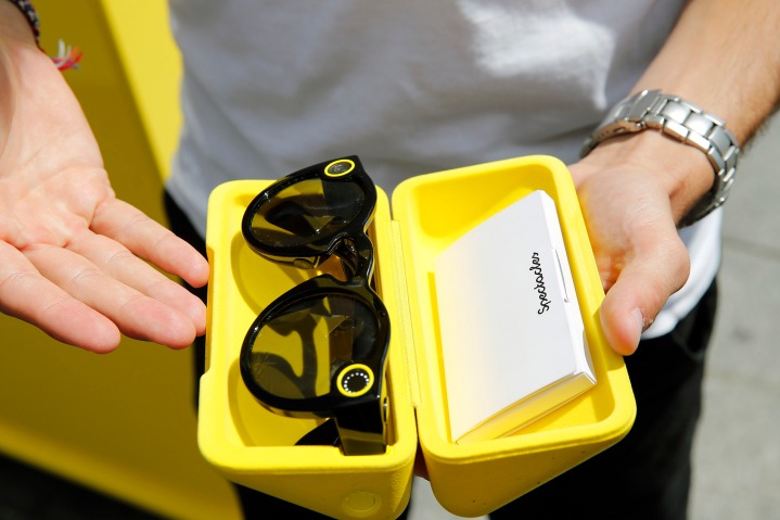 A young man shows his 'Spectacles'-glasses.