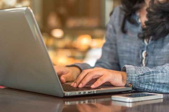 A person working on Laptop.