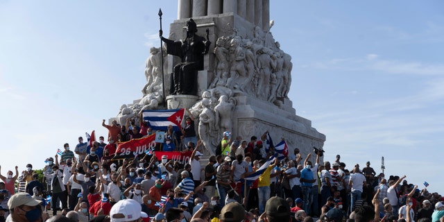 Anti-government protesters gather at the Maximo Gomez monument in Havana, Cuba, Sunday, July 11, 2021. (AP Photo/Eliana Aponte)