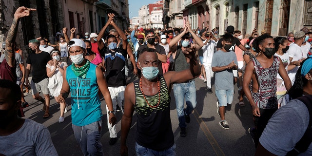 People shout slogans against the government in Havana, Cuba, on July 11, 2021. (Reuters/Alexandre Meneghini)