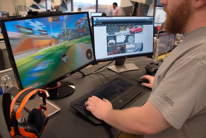 Someone playing Rocket League at a standing desk.